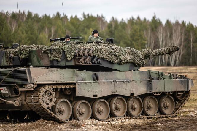 Polish and Ukrainian soldiers are seen on a Leopard 2 A4 tank during training at the Swietoszow Military Base in Swietoszow, western Poland, February 13, 2023.