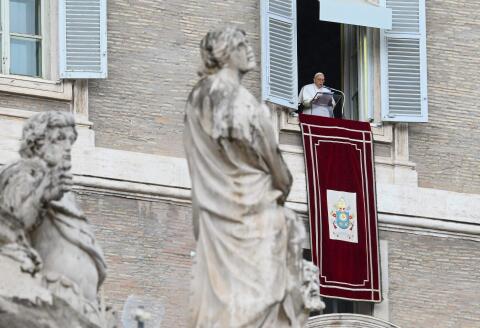 Pope Francis speaks from the window of the apostolic palace during the weekly Angelus prayer on February 26, 2023 in The Vatican. (Photo by Vincenzo PINTO / AFP)