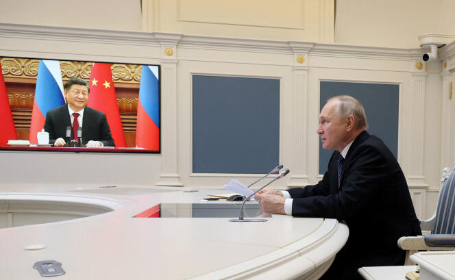 Russian President Vladimir Putin talks with Chinese President Xi Jinping via video from Moscow, Dec. 30, 2022.