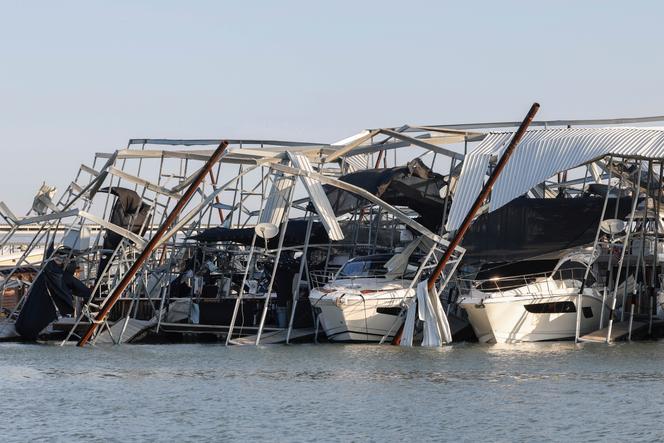 Docks and boats are damaged at Lake Lewisville marina in Lewisville, Texas, on March, 3, 2023, after a severe storm moved through the area the night before.