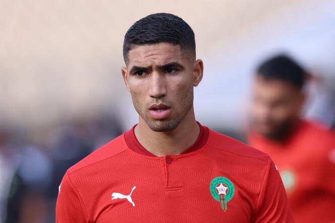 In this file photo taken on January 10, 2022, Morocco's defender Achraf Hakimi warms up ahead of the Africa Cup of Nations (CAN) 2021 football match between Morrocco and Ghana at Ahmadou Ahidjo stadium in Yaounde, Cameroon. 