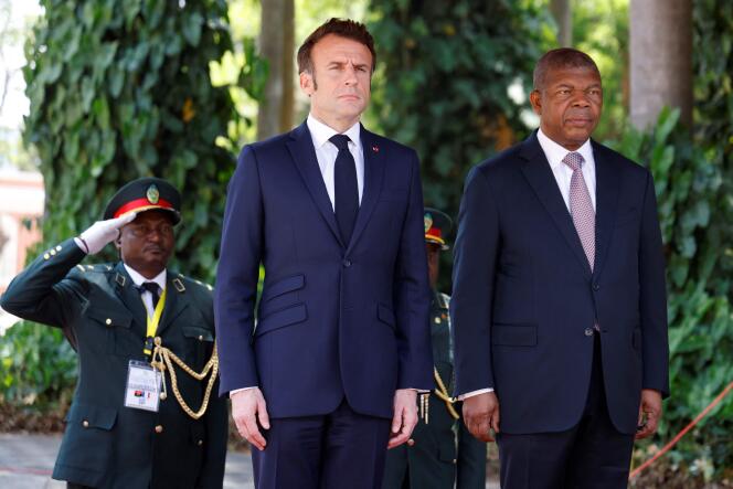 French President Emmanuel Macron is welcomed by Angolan President Joao Lourenço at the Casa Rosada presidential palace in Luanda on March 3, 2023.
