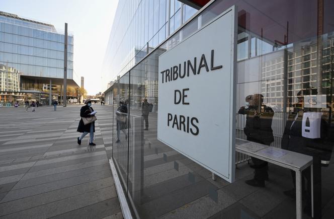 People arrive at the main entrance of the Paris courthouse, on March 22, 2022. 