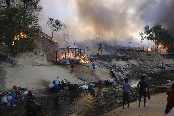 Rohingya refugees try to salvage their belongings after a major fire in their Balukhali camp at Ukhiya in Cox's Bazar district, Bangladesh, March 5, 2023. 