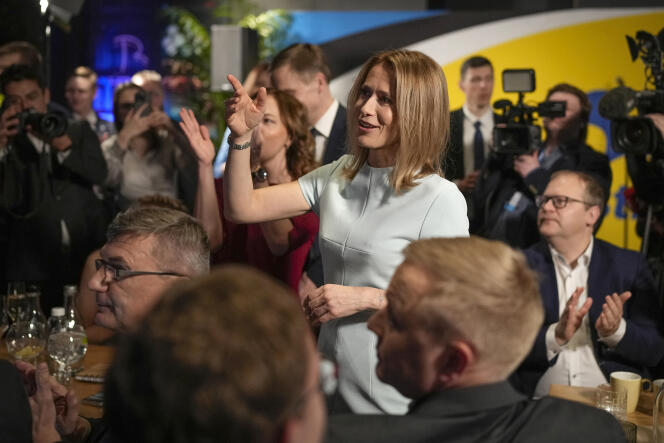 Prime Minister Kaja Kallas, center, reacts to the announcement of preliminary results of the election in Tallinn, Estonia, Sunday, March 5, 2023.