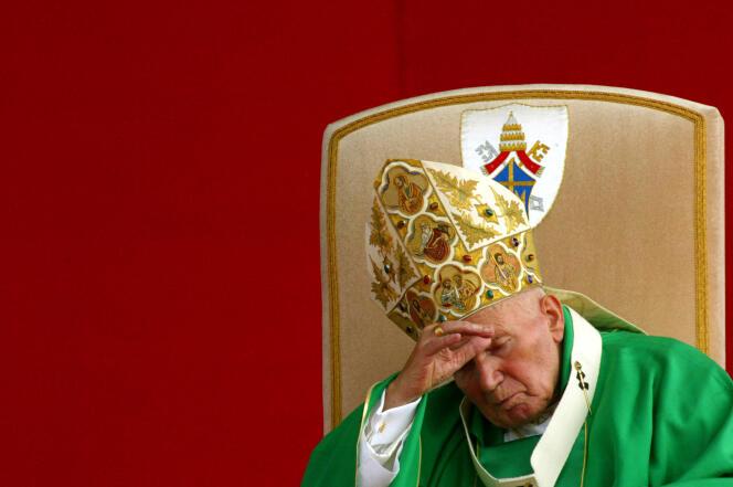 This file photo taken on August 18, 2002, shows former Pope John Paul II celebrating a mass in Krakow's Blonie ground. 