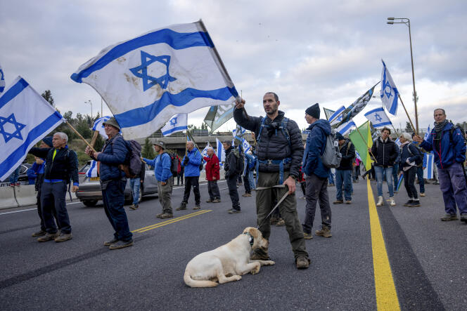 Israeli army reservists protest against the proposed overhaul of the judicial, on a highway between Tel Aviv and Jerusalem, February 9, 2023.