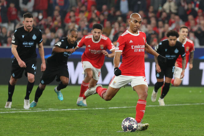 Benfica's Portuguese midfielder Joao Mario scores his team's fourth goal during the UEFA Champions League round of 16 second leg football match between SL Benfica and Club Brugge at the Luz stadium in Lisbon on March 7, 2023.