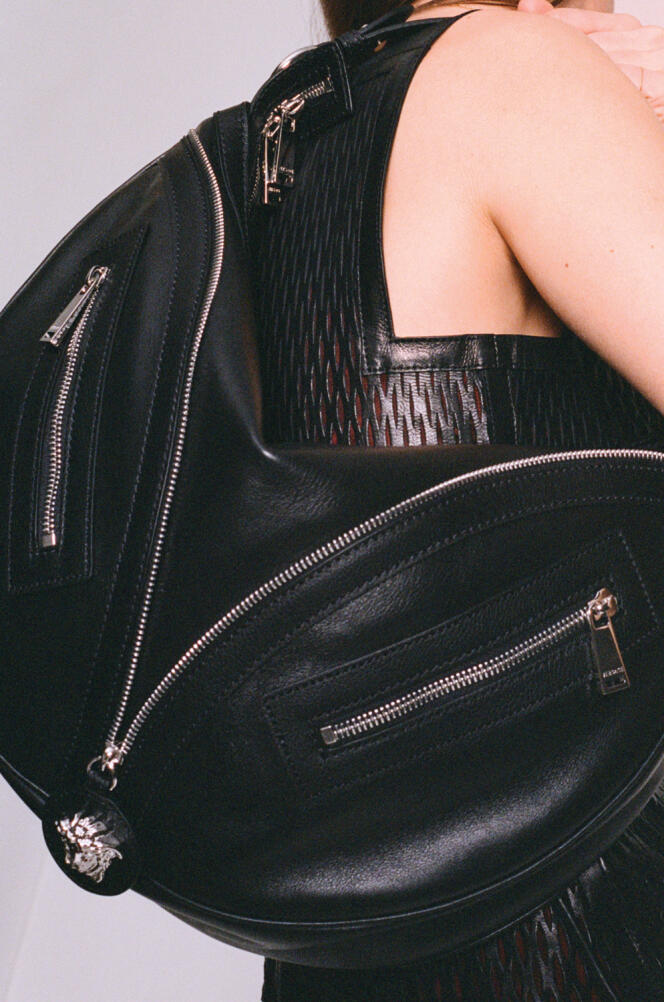     Hobo Repeat bag in calf leather, Versace, €1,750.  Hermes dress.