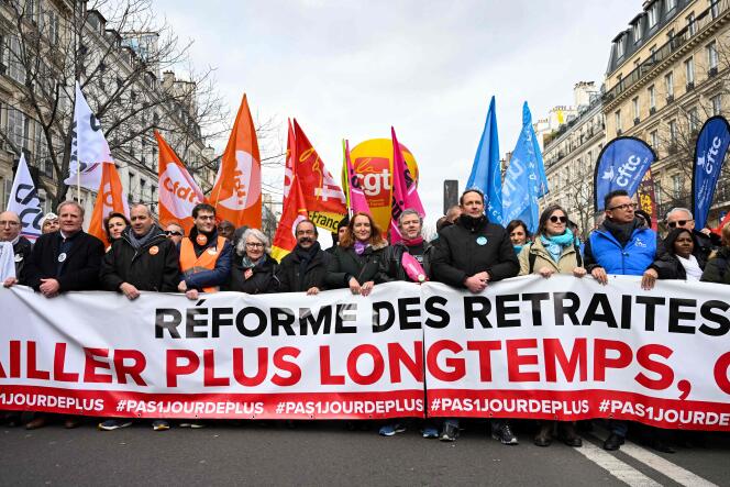 French union leaders take part in a demonstration as part of a nationwide day of strikes and protests called by unions over the country's proposed pension reform, in Paris on March 11, 2023.
