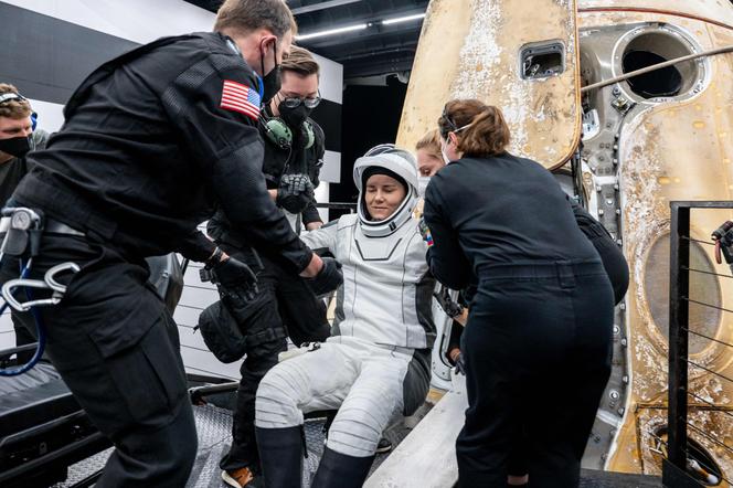 In this NASA photo, Russian cosmonaut Anna Kikina is extracted from the SpaceX spacecraft 'Endurance' shortly after it crashed off Tampa, Florida on March 11, 2023.