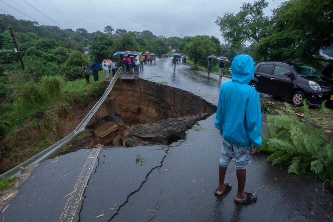 A general view of a collapsed road caused by flooding waters due to heavy rains following cyclone Freddy in Blantyre, Malawi, on March 13, 2013. Malawi's leader on March 13, 2023 declared a state-of-disaster in several southern districts including the commercial hub Blantyre after the powerful cyclone Freddy made a comeback killing dozens.