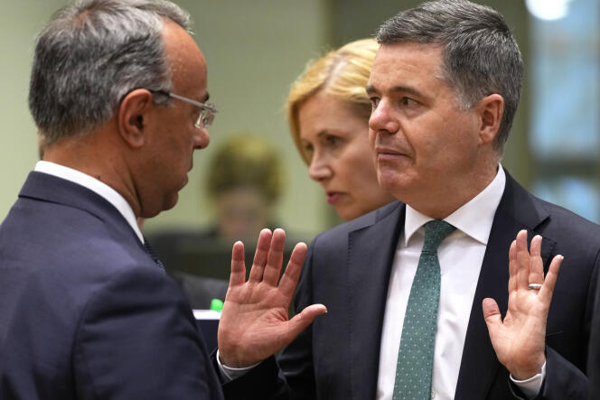 Eurogroup (meeting of eurozone finance ministers) President Paschal Donohoe of Ireland, right, talks to Greek Finance Minister Christos Staikouras in Brussels on March 13, 2023.