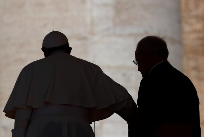 Pope Francis, accompanied after the weekly general audience in St. Peter's Square, at the Vatican, April 27, 2022.