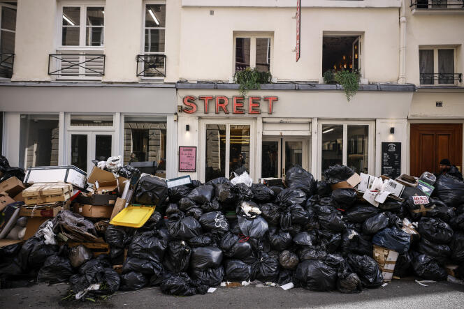Uncollected rubbish is piled up on a street in Paris, Wednesday, March 15, 2023, during a strike by sanitation workers. 