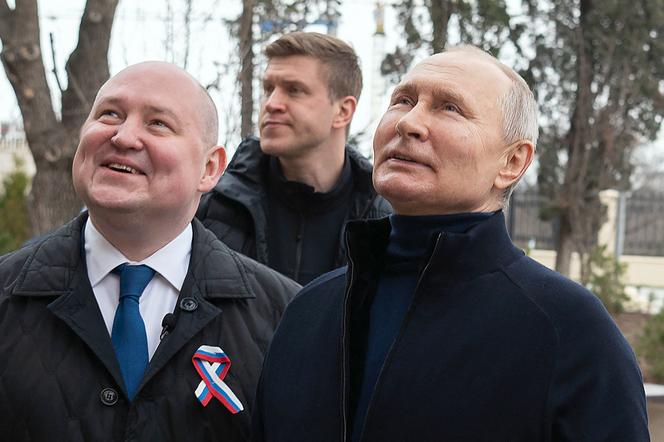 Sevastopol Governor Mikhail Razvojayev (L) and Vladimir Putin at the Chersonesos Taurica Historical and Archaeological Park in Sevastopol on March 18, 2023. 