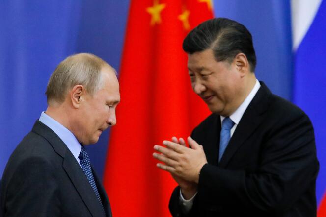 In this file photo taken on June 6, 2019, Russia's President Vladimir Putin (L) and China's President Xi Jinping attend a ceremony presenting Xi with a degree from the Saint Petersburg State University on the sidelines of the St. Petersburg International Economic Forum in Saint petersburg.