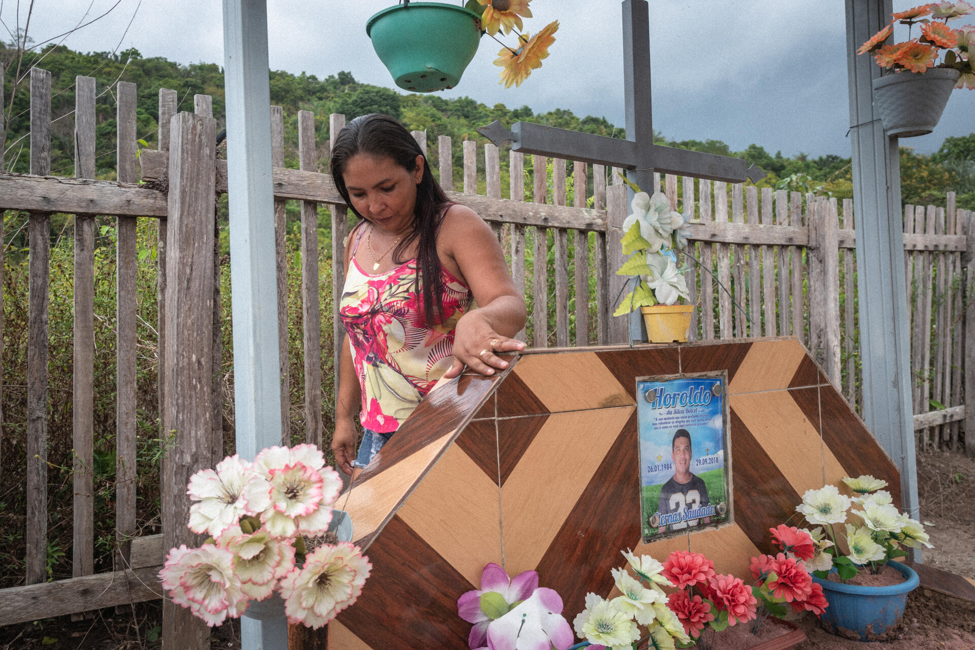 Cleia, 41, the widow of Haroldo Betcel, visiting his grave.  “I always told him to be careful and not to get in trouble.  But Haroldo was that kind of person, he was too sensitive to land issues.  He was defending his community by any means possible.”
