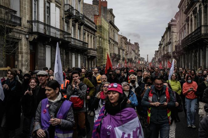 Protesters march during a demonstration, a few days after the government pushed a pensions reform through parliament without a vote, using Article 49.3 of the Constitution, in Bordeaux, southwestern France, on March 22, 2023.