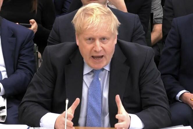 Boris Johnson addresses a parliamentary committee during a hearing into the 'partygate' case, Wednesday March 22, 2023. 