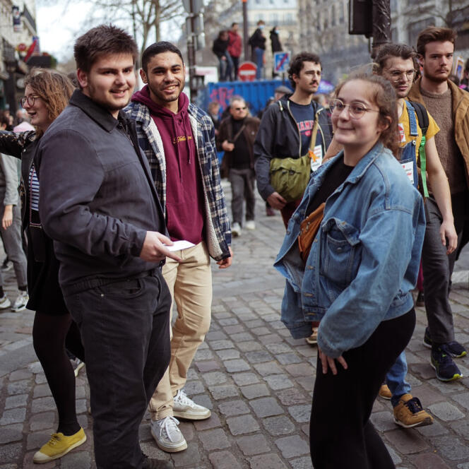 Ya, Anaïs and Arthur, 19, students, during the demonstration against the pension reform, in Paris, March 23, 2023.