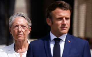 French President Emmanuel Macron (R) and French Prime Minister Elisabeth Borne (L) attend a ceremony marking the 82nd anniversary of late French General Charles de Gaulle's resistance call of June 18, 1940, at the Mont Valerien memorial in Suresnes near Paris, on June 18, 2022. (Photo by GONZALO FUENTES / POOL / AFP)