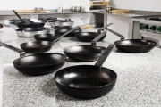 Frying pans in a kitchen.
