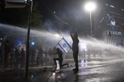 Police use water cannons against protesters, March 27, 2023, in Tel Aviv.