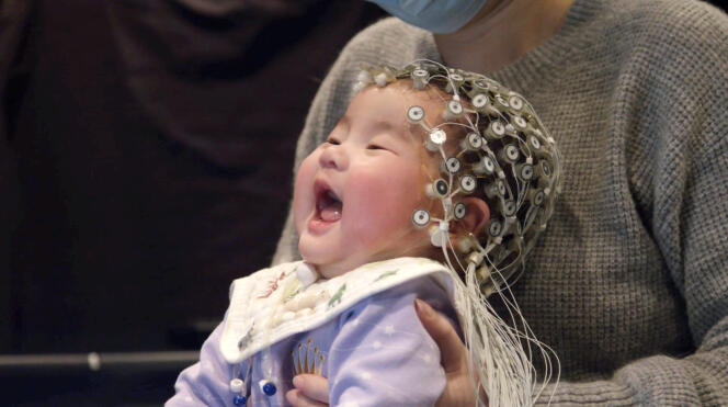 A baby listening to the Rolling String Quartet during an experiment by Professor Emmanuel Bigand, who studies the effects of music on the brain.