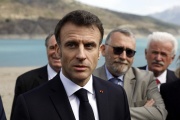French President Emmanuel Macron speaks to journalists upon his arrival in Savines-Le-Lac, southeastern France, on March 30, 2023.
