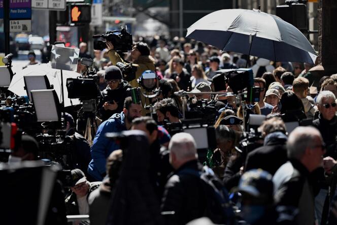 Dozens of journalists pose in front of Trump Tower in New York on April 3, 2023.