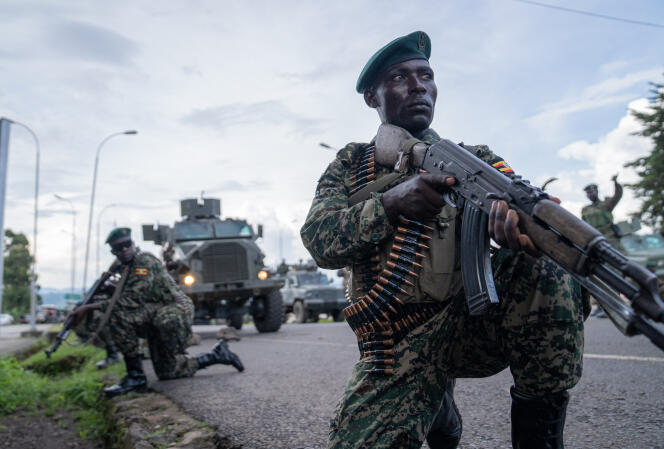 Ugandan soldiers take position at the border with Bunagana, March 30, 2023.