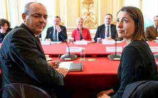 TOPSHOT - French Democratic Confederation of Labour (CFDT) union's general secretary Laurent Berger (L, 1rst row) and French CGT trade union General Secretary Sophie Binet (R, 1strow) pose prior to talks between France's Prime minister Elisabeth Borne and inter-unions representatives at the Hotel de Matignon in Paris on April 5, 2023, after a pensions reform was pushed through parliament by the French government without a vote, using the article 49.3 of the constitution. (Photo by Bertrand GUAY / POOL / AFP)