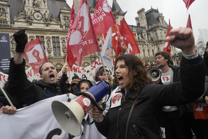 Demonstrators gather outside the Paris town hall, Friday, April 14, 2023 in Paris.