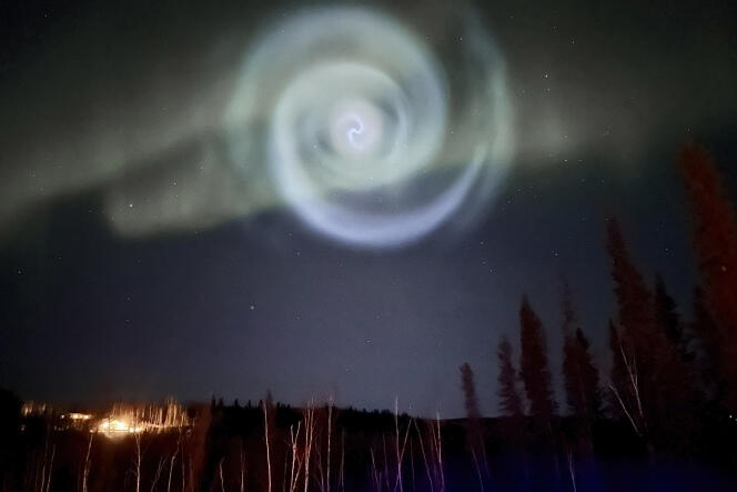 A star-like blue swirl appears in the middle of the aurora borealis for a few minutes in the Alaskan sky near Fairbanks on April 15, 2023.