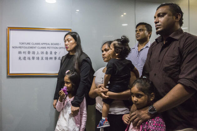 From left to right: Filipina Vanessa Rodel with her Sri Lankan daughter Nathika Nonis, left Subun partner Dilina Kelapata and their children and Sri Lankan Ajith Pushpakumara, all refugees, at the Office of the Torture Claims Appeals Commission in Hong Kong on July 17, 2017.