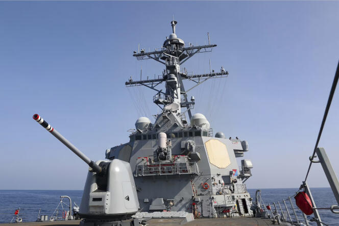In this photo provided by the US Navy, the US destroyer USS 