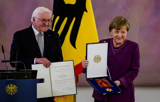 German President Frank-Walter Steinmeier presents the Special Class Grand Cross of the Order of Merit to former German Chancellor Angela Merkel on April 17, 2023 in Berlin.