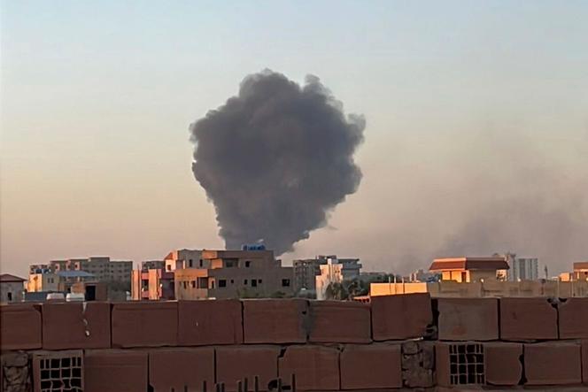 Smoke fills the sky in Khartoum near Doha International Hospital on Friday, April 21, 2023.