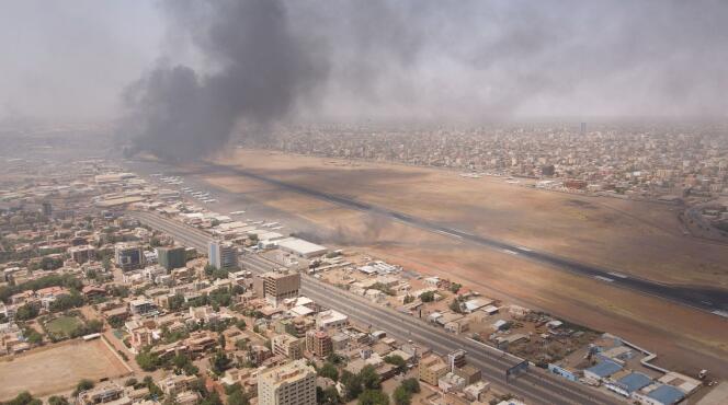 Smoke rises over the city as the army and paramilitaries clash in a power struggle, in Khartoum, on April 15, 2023. 