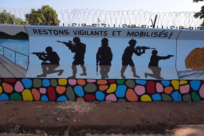 FILE - A mural is seen in Ouagadougou, Burkina Faso, on March 1, 2023. Burkina Faso's government has opened investigations into allegations of human rights abuses by its security forces after a video surfaced that appeared to show the extrajudicial killing of seven children in the country’s north. A government spokesman said Thursday April 20, 2023 that “the conclusions of the said investigations will lead, if the facts are established, to legal proceedings against the persons responsible.” (AP Photo, File)