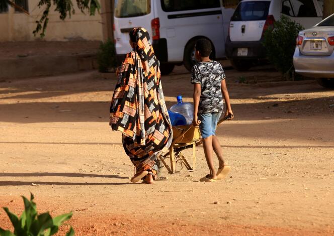 Residents left to fetch water in Khartoum on April 20, 2023.