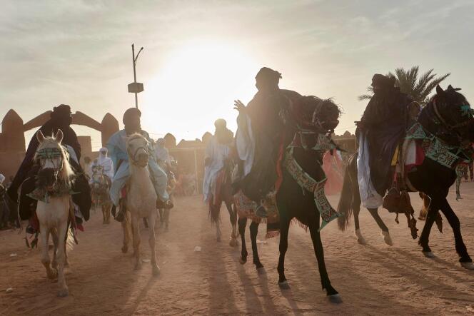 Riders enter the residence of the Sultan of Agadez for the traditional Eid-el-Fitr parade, April 21, 2023.