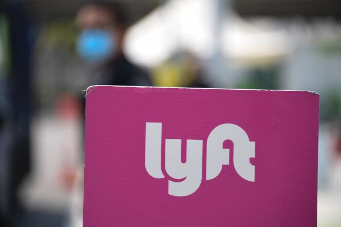 In this file photo taken on August 20, 2020 a sign for the Lyft ride share pick up area is seen at Los Angeles International Airport in Los Angeles, California.