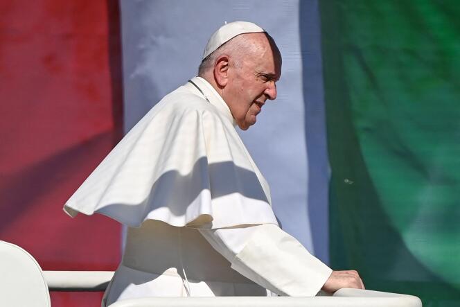 Pope Francis, in front of a Hungarian flag during the International Eucharistic Congress, in Budapest, September 12, 2021.