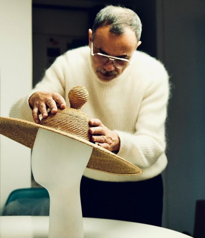 Cyril Rahon arranges a traditional Vaudois hat in January in Paris.