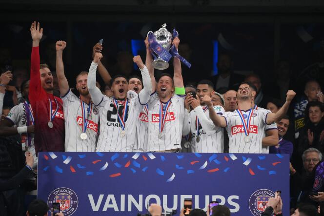 Toulouse's Belgian midfielder Brecht Dejaegere holds the trophy after winning the French Cup final football match between Nantes (FC) and Toulouse (FC) at the Stade de France, in Saint-Denis, on the outskirts of Paris, on April 29, 2023.