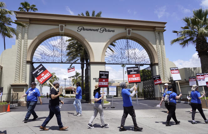 Members of The Writers Guild of America West picket at an entrance to Paramount Pictures, Tuesday, May 2, 2023, in Los Angeles. 