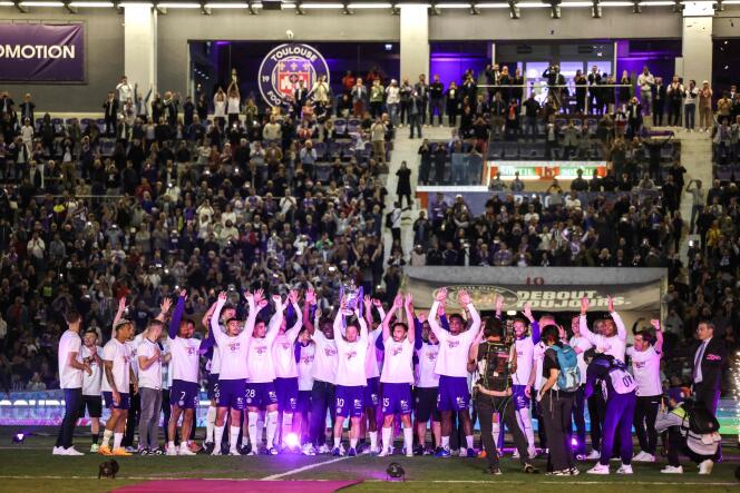 Toulouse players celebrate their victory in the Coupe de France, with their supporters, at home, on May 2, 2023.