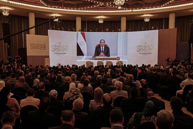 Egyptian President Abdel Fattah Al-Sissi addresses representatives of trade unions, political forces and NGOs, via videoconference, during the inaugural meeting of the national dialogue, in Cairo, Wednesday, May 3, 2023. 
